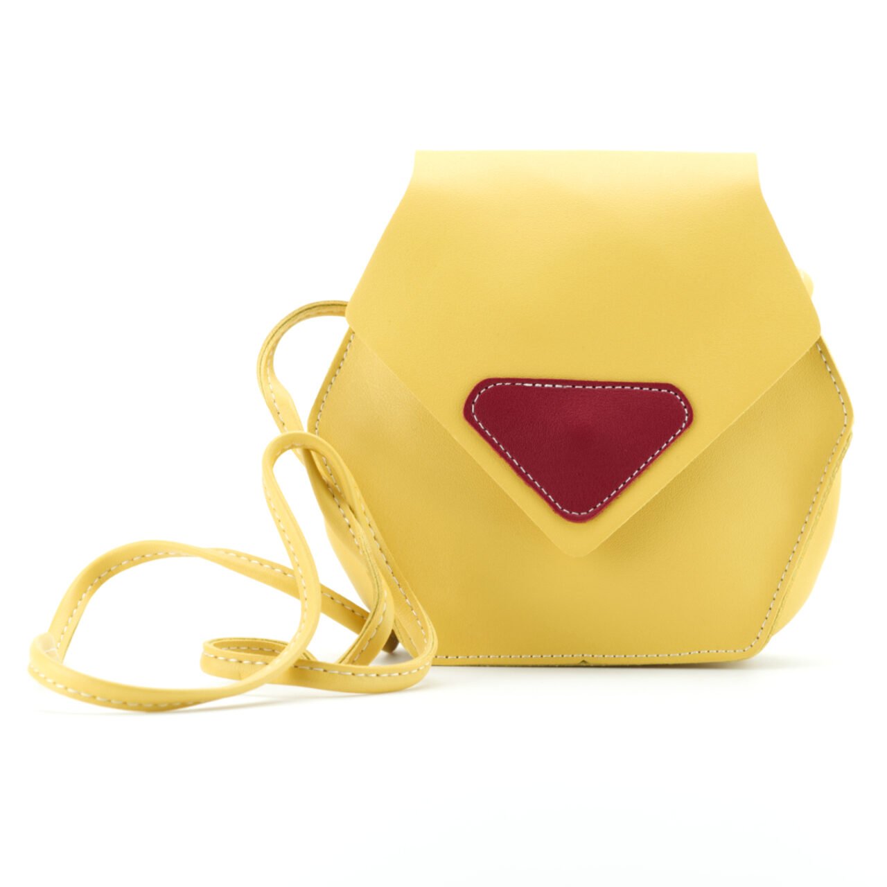 Yellow crossbody bag with red front detail — product photography on white background