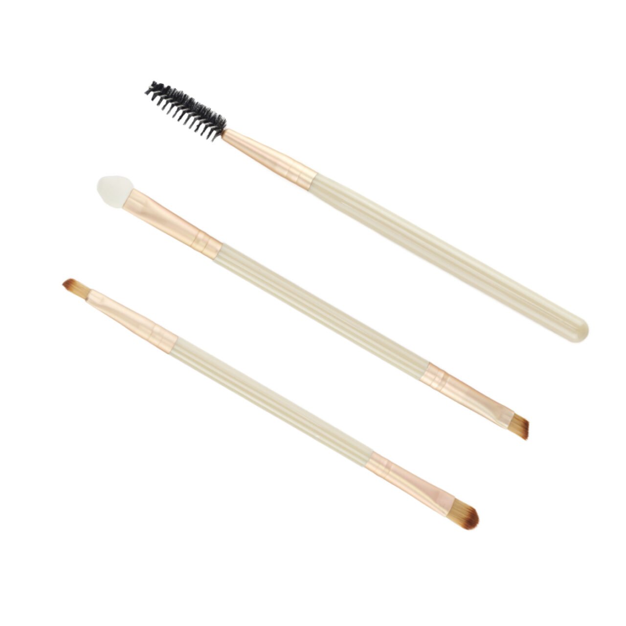 Set of three makeup brushes with beige handles product photography